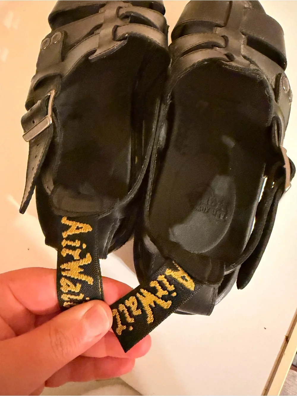 Dr. Martens Black Leather Buckle Fisherman Sandals with Yellow Stitching